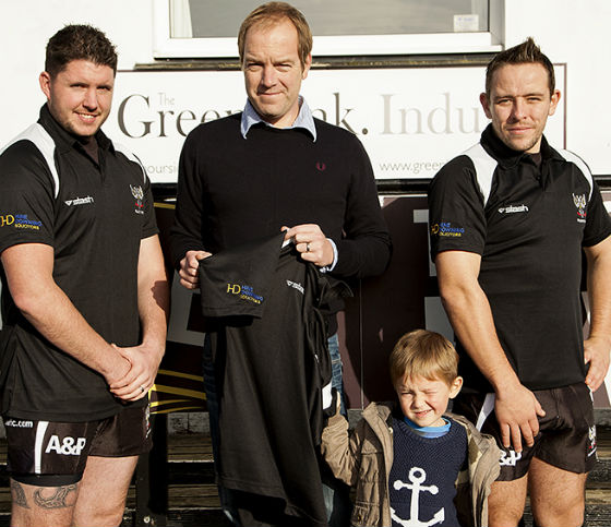 Hine Downing solicitor Will Richards presents rugby kit
