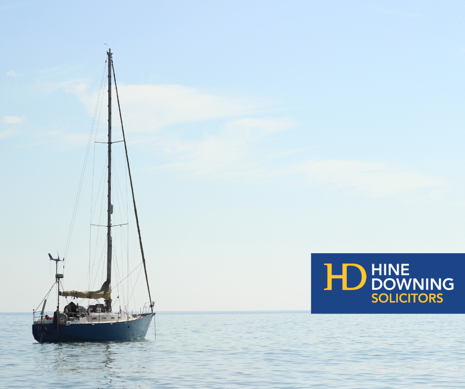 Sailing boat at sea with Hine Downing logo.